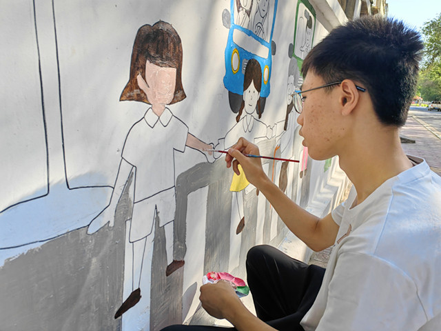 3.辖区中小学生参加文化墙创作-克拉玛依市白碱滩区（克拉玛依高新区）三平路街道振兴社区 刘祥贞 供稿  联系电话：18009903291 审核人：闫宇_副本.jpg